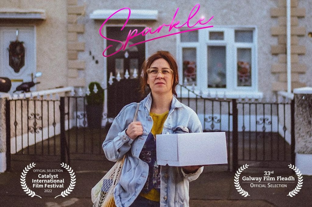 A film poster for a movie called Sparkle, featuring Andie McCaffrey. It features official selections from the 2022 Catalyst International Film Festival and the 33rd Galway Film Fleadh.